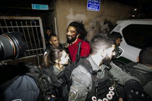 Israeli police officers take a Palestinian into custody during a demonstration at Sheikh Jarrah neighborhood after Israeli government's plan to force some Palestinian families out of their homes in East Jerusalem on May 04, 2021. Photo by Mostafa Alkharouf, Anadolu Images